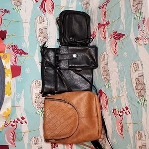 3 black 1 Camel colored crossbody purses. All are in excellent condition.